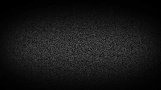 digital noise A close up of a white and gray noise with a grainy texture. The pattern of tints and shades create a contrast with the dark background, giving it a peach and carmine undertone. TV