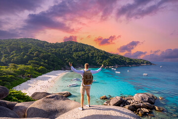 Happy tourist man with backpack in touristic place Travel Similan islands, Thailand