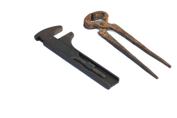 monkey wrench and iron cutting pliers isolated on white background