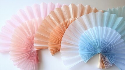 Colorful Paper Fans in Soft Pastel Shades for Decoration or Crafts
