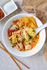 Tom yum Wonton Soup in white bowl 