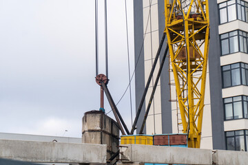 Details of a crane on a construction background