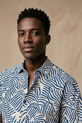 Obraz premium arafed man in a blue and white shirt poses for a picture