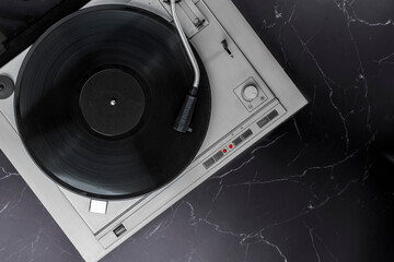 Fototapeta premium Turntable Vinyl records, party music, top view. Empty copy space for record label mockup. Vintage retro sound recording style. Background for the design of a poster, postcard, flyer for music events