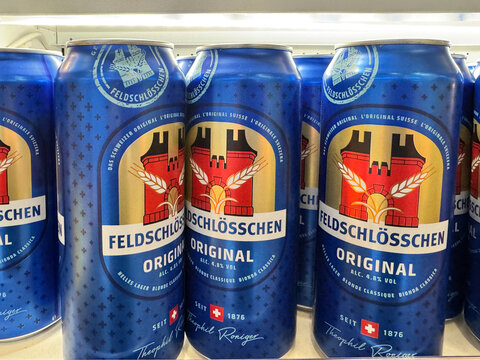 Zurich, Switzerland - December 8, 2024: Feldschlosschen Original beer - cans on display. This is a Swiss beer