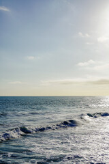 Fototapeta premium Early morning winter sky and blue turquoise water texture and sea of waves and foam