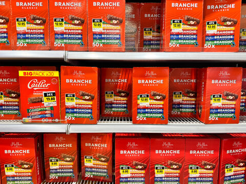 Geneva, Switzerland - December 10, 2024: Halba Branche Classic chocolate candy bars in bulk for sale at a Coop grocery store