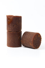 Close-up of Brown Sugar Cubes on White Background