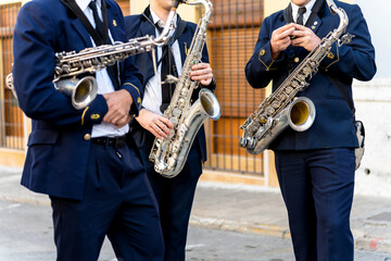 Fototapeta premium Band musicians with their instruments on the street. Typical music bands in Spain.
