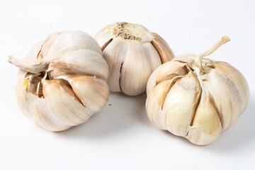 Three Bulbs of Fresh Garlic on White Background