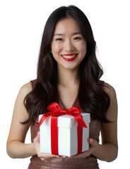 A smiling Asian woman with both holds a red gift box, wearing a beige sleeveless dress.