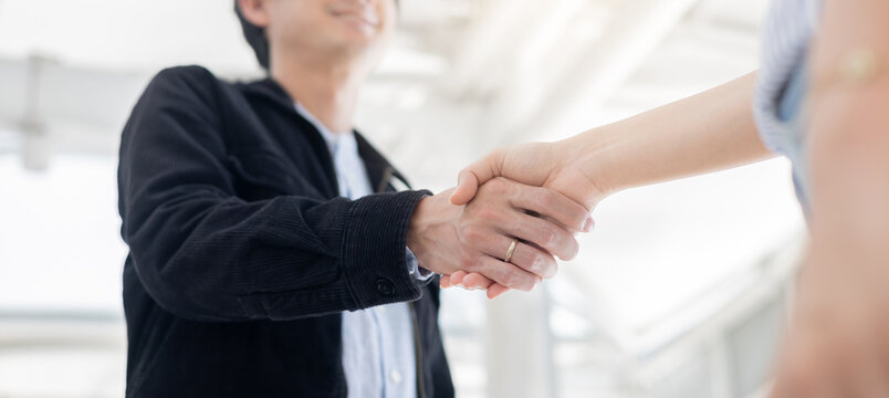 close up investor businessman handshake with partner vendor,collaboration of two ceo leader hand shake for agreement or deal financial cooperative concept.	