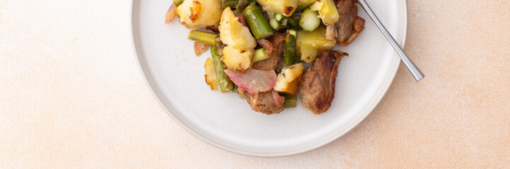Stewed duck fillet with potatoes and asparagus and radishes, mixed salad of various greens, baked...