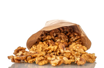 Shelled walnuts with paper bag, close-up, isolated on white background.