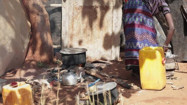 An Ethiopian woman cooks over an open fire in the Borana region of Ethiopia.