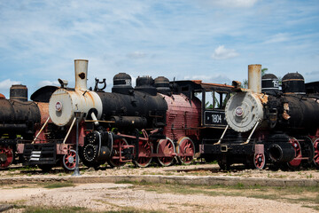 Old vintage steam engine locomotives that were used on sugar plantations in the Cuban countryside.