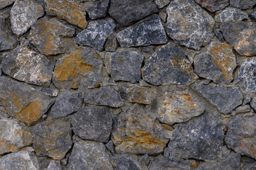 Beautifully textured stone wall showcasing natural patterns and earthy tones