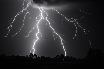 A lightning storm creates a dynamic display in the night sky, showcasing nature's fierce power and intensity