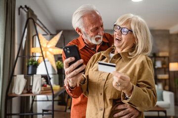 senior husband and wife buy online on cellphone with credit card