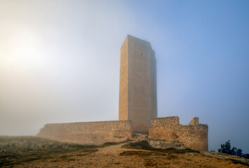 View of the medieval Torre de Armas in the town of Alarcon, Cuenca, Castilla-La Mancha, Spain, in a...