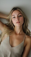 Natural Portrait of Young Woman with Long Blonde Hair and Serene Expression
