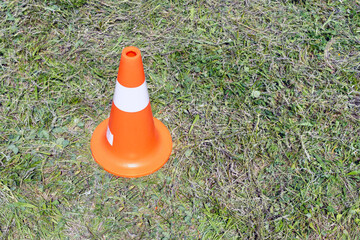 cone on the road on green grass
