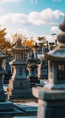 Serene Stone Lanterns at Japanese Cemetery Under Bright Sky