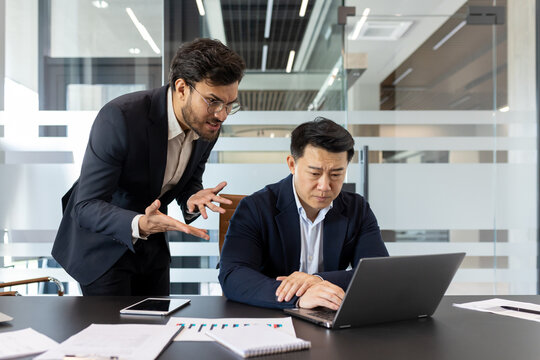 Conflict in the office, stress and aggression in the workplace, male boss yelling at subordinate, businessman not satisfied with work results and achievements.