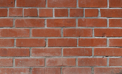 Fototapeta premium Pared de Ladrillos y Adoquines Rojos: Textura Urbana Auténtica con Cemento Gris, Resaltando el Encanto Industrial y la Historia de una Fábrica Abandonada con Alto Detalle y Definición