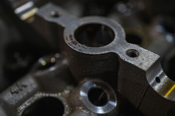 Close-up view of industrial metal gears in motion, symbolizing engineering, machine building, machine construction and precision manufacturing, disassembled car engine, spare parts. Selective focus