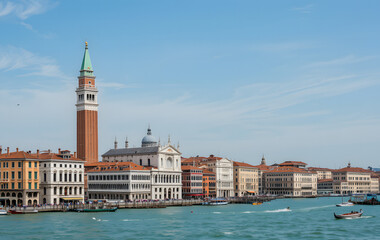 Beautiful view of Venice, Italy with Campanile tower of Saint Mark's Cathedral, Basilica on San Marco square and Doges' Palace. Italian buildings cityscape. Famous romantic city on water 