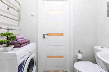 modern bathroom room with toilet and washing machine