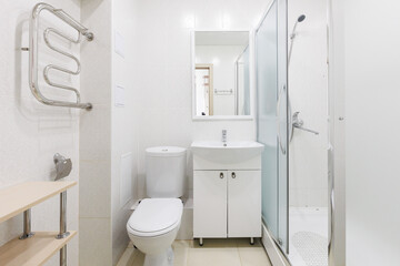 modern bathroom room with toilet and washing machine