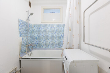 modern bathroom room with toilet and washing machine