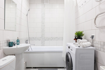 modern bathroom room with toilet and washing machine