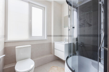 modern bathroom room with toilet and washing machine