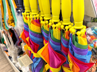 Vibrant umbrellas hanging together, ready for a colorful day ahead