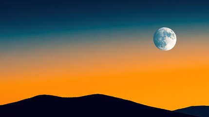   Full moon in the sky above mountains with mountain silhouette in the foreground