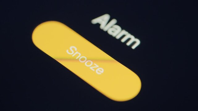 Close up of alarm going off on mobile phone