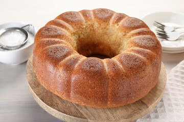 Freshly baked sponge cake served on white table, closeup