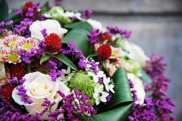 Bouquet of pink roses, limonium, arabian star flower (ornithogalum arabicum) and miniature chrysanthemums.
