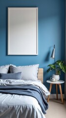 Modern blue bedroom with blank vertical frame above bed, wooden nightstand, houseplant, pillows, and natural daylight through window
