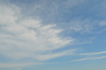 Blue sky background with clouds. Cloudy sky.
