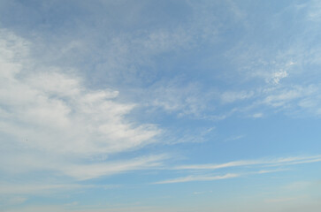 Blue sky background with clouds. Cloudy sky.