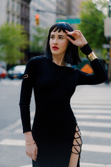 Chic Fashionista in Black Dress Exuding Elegance on Streets of New York City