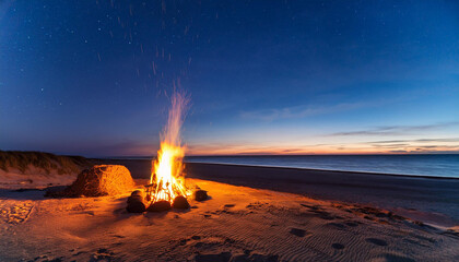 campfire at the sandy seashore at night tversted denmark