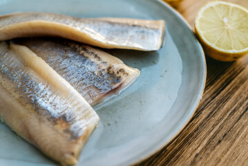 Marinated salted herring fillet in oil