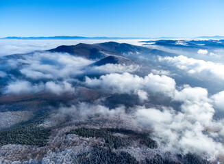 Aerial view of the Harghita Mountains - Romania. The Ciomatu - Puturosu massif seen from above in winter