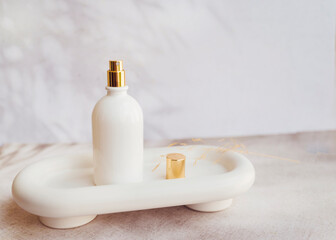 White  Perfume  Bottle  on Shadows Background