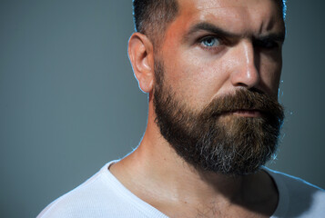 Man portrait. Handsome bearded man, closeup portrait. Serious man with beard and mustache in casual...